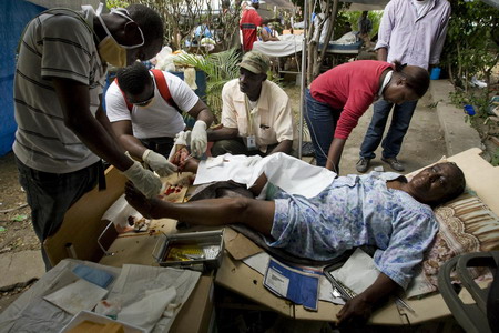 Haitians pray, cry for help in the ruins