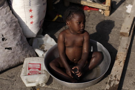 Haitians pray, cry for help in the ruins