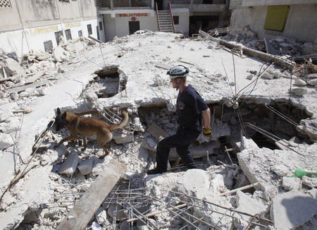 Haitians pray, cry for help in the ruins