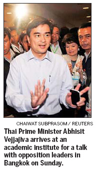 Thai PM meets foes on live television encounter