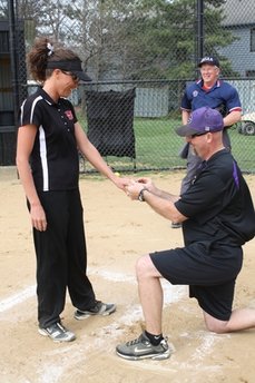 Softball coach proposes to rival on field