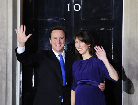 Cameron leads Britain into new coalition era