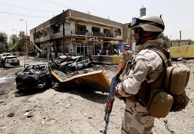 Suicide bombs kill 33 in Iraq, officials say