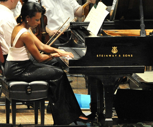 Former US Secretary of State Rice performs with orchestra