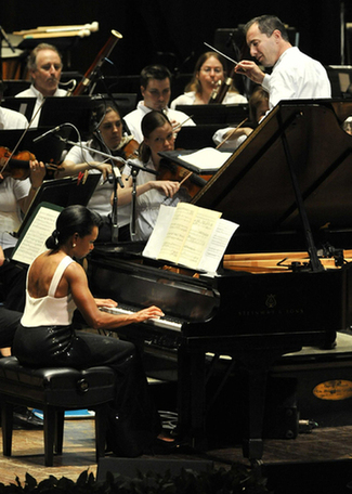 Former US Secretary of State Rice performs with orchestra