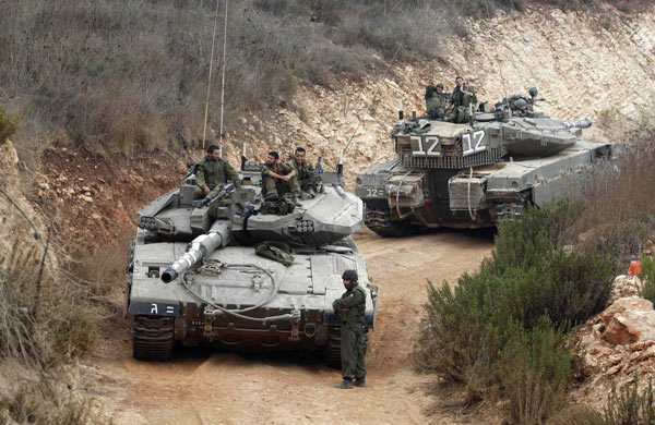 Israeli military uprooting trees on Lebanon border