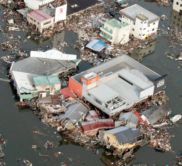 NE Japan coast ravaged by flood, fires after quake