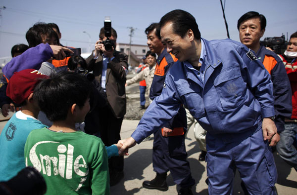 Japan's PM visits fishing city wrecked by tsunami