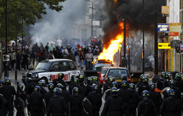 Riots continue in London, Cameron cuts short holiday