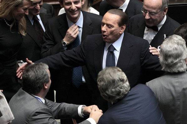 Berlusconi wins confidence vote but still weak