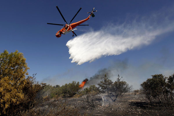 Greece battles wildfires upon general polls