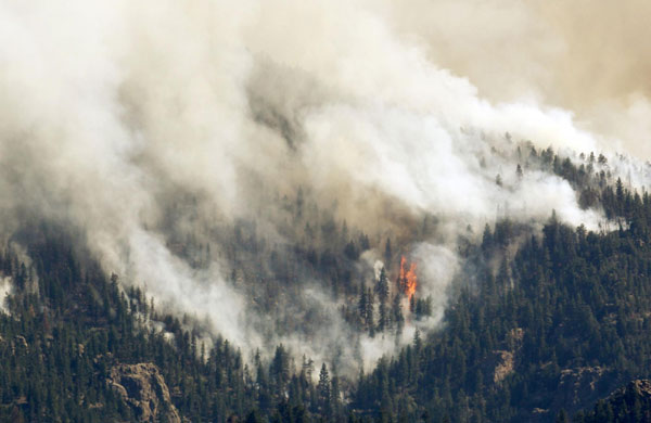 Massive wildfires continue to char western USA