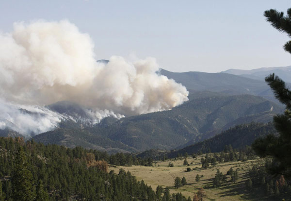 Massive wildfires continue to char western USA