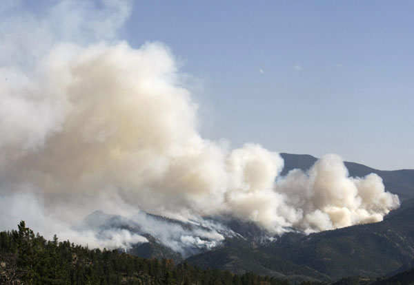 Massive wildfires continue to char western USA