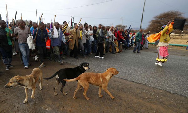 S. African miners march outside Marikana mine