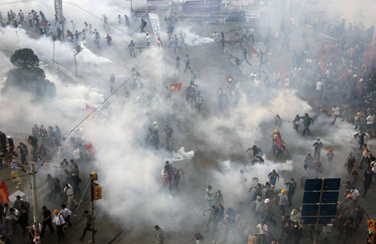 Turkish police fight protesters, clear square