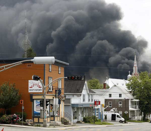 Derailed train explodes, levels center of Canada town