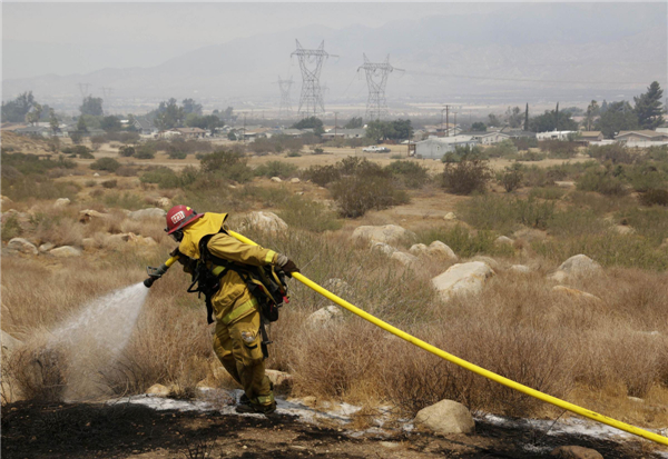 California wildfire destroys 26 homes