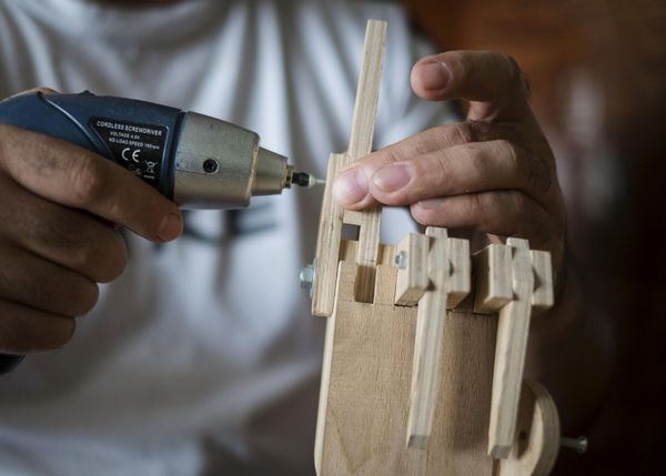 Crane operator creates wooden robot