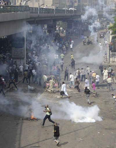 At least 15 killed as Egypt troops storm pro-Morsi camps