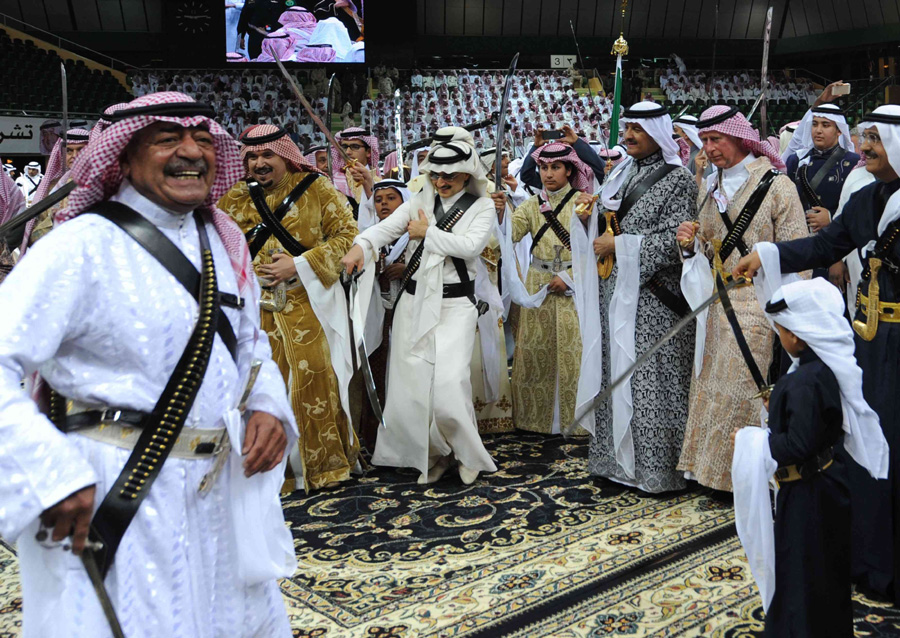 Prince Charles dances in traditional Saudi dress