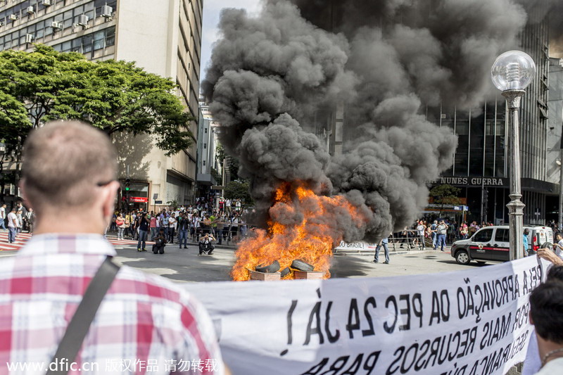 Brazilian police officers stage 24-hour strike ahead of World Cup