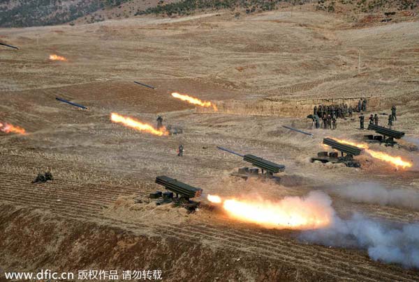 DPRK fires some 100 shells into eastern waters