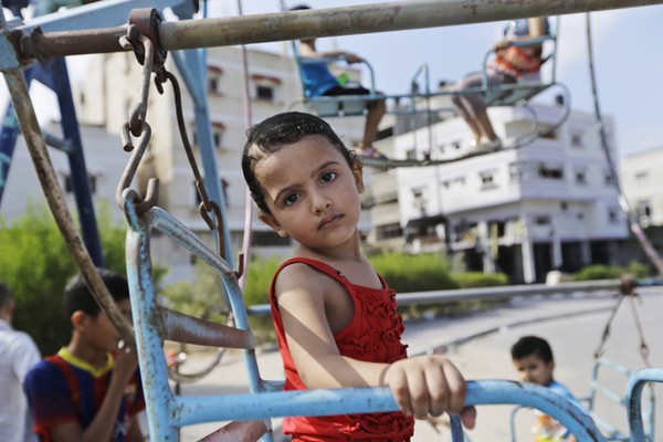 Palestinian children celebrate Eid al-Fitr in refuge camp