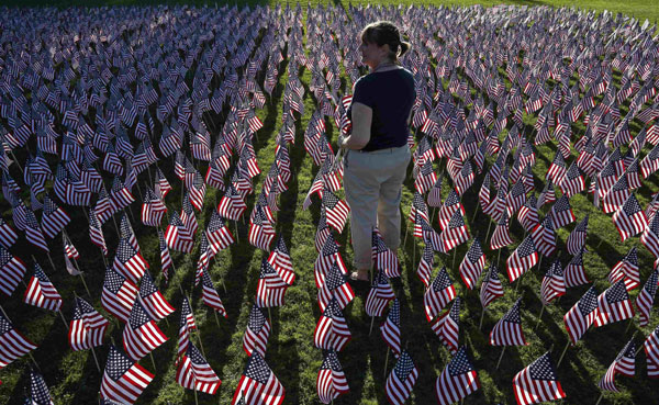 Americans mark the 13th anniversary of the 9/11 attacks