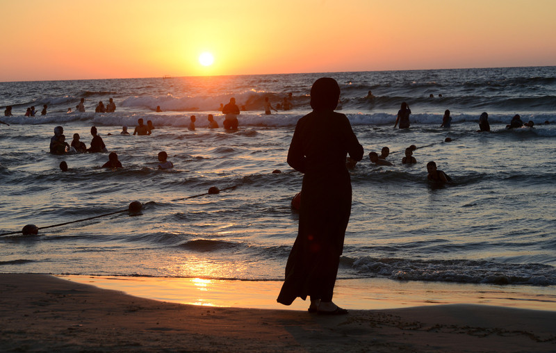 Palestinian Muslims enjoy Mediterranean Sea