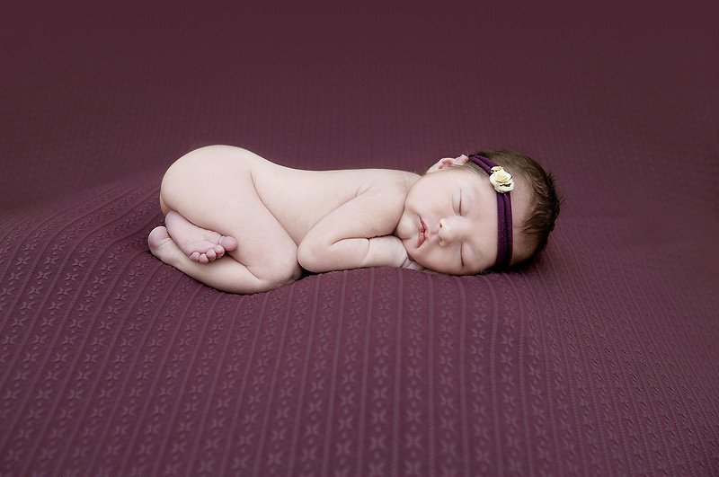 Sleeping newborns photographed in adorable poses