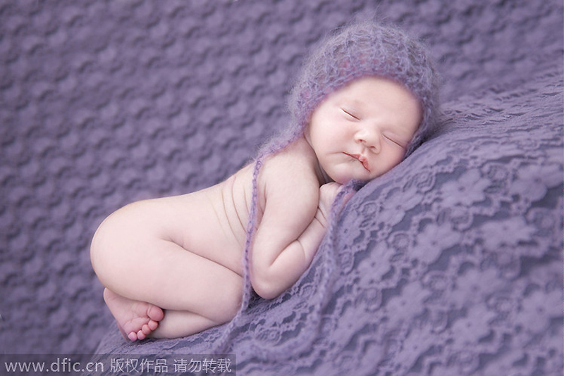 Sleeping newborns photographed in adorable poses