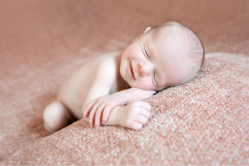 Sleeping newborns photographed in adorable poses