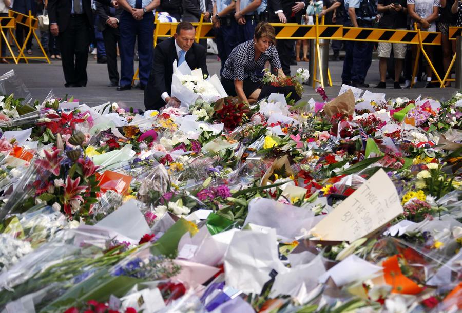 People pay floral tributes to Sydney siege victims