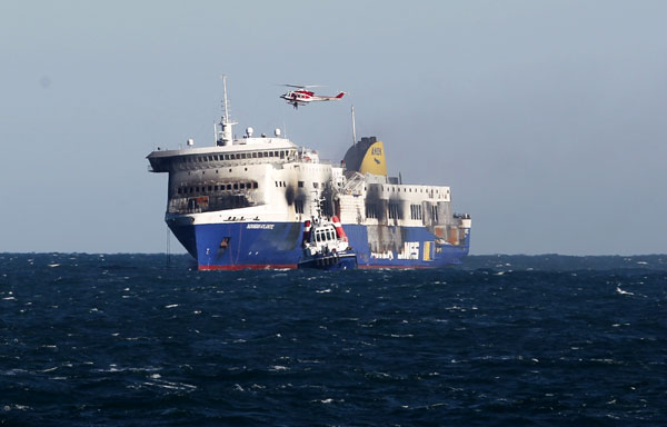 After deadly blaze, burnt-out ferry towed to Italy