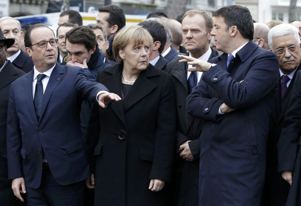 Leaders walk arm-in-arm as millions protest Paris attacks