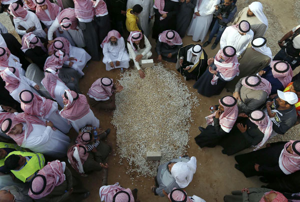 Saudi King Abdullah mourned in simple burial