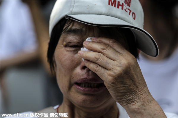 MH370 families remember one year on