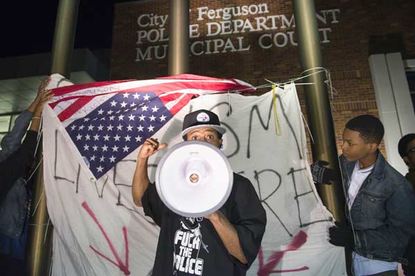 Two officers shot outside Ferguson police department