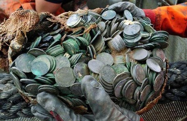 Silver coins worth $50 million recovered from WWII wreck at record depth
