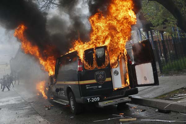 Riot, looting prompt state of emergency, curfew in Baltimore