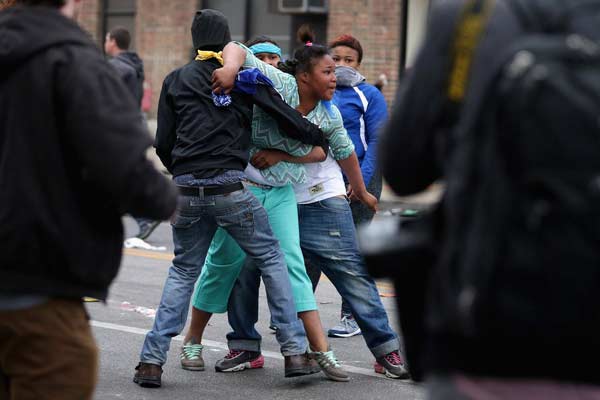 Riot, looting prompt state of emergency, curfew in Baltimore