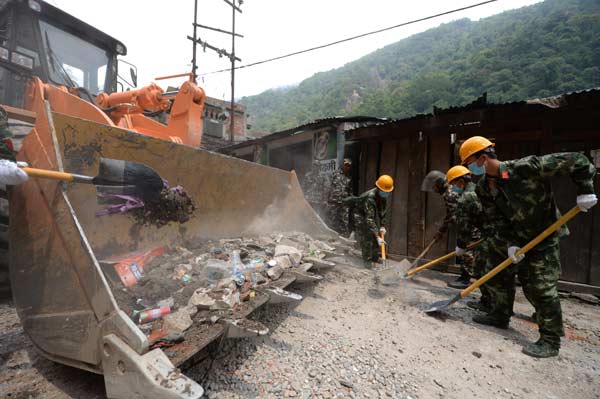 China's quake-relief armed police restore cross-border highway with Nepal