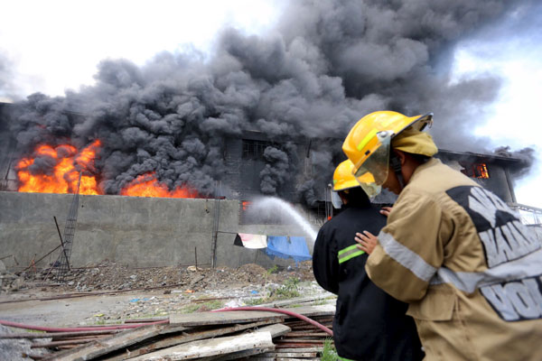 Death toll in Philippine slipper factory fire rises to 72