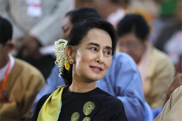 Myanmar's Aung San Suu Kyi leaves for her first visit to China