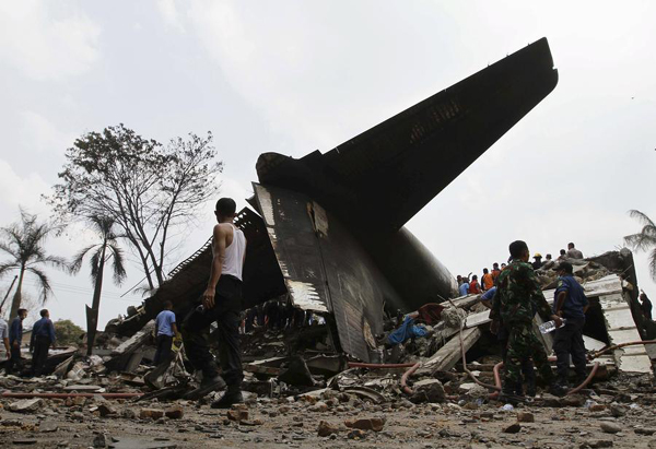 Military plane crashes into residential area in Indonesia