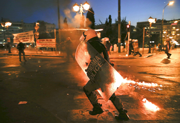 Greek parliament approves debt deal and first reforms