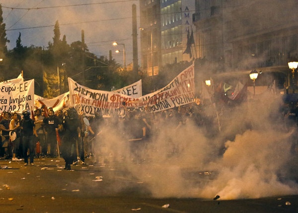 Greek parliament approves debt deal and first reforms