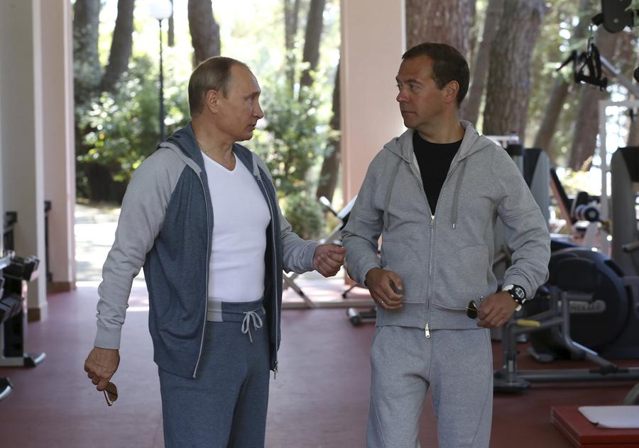 Russia's Putin works out in gym with Medvedev