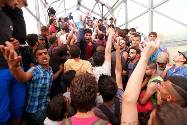 Hungarian authorities halt train packed with refugees headed for border